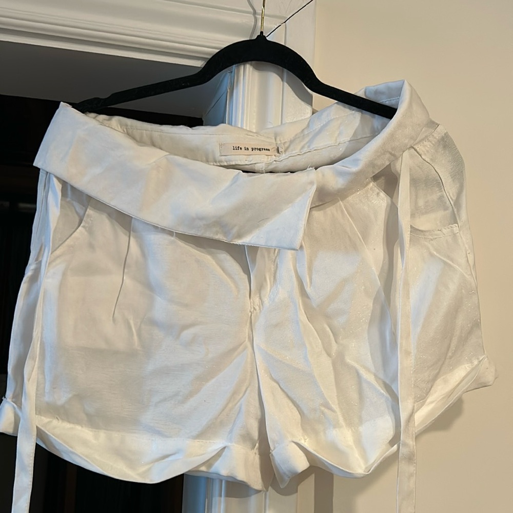 Life in progress white shorts with ties and fold over waist. They have pockets